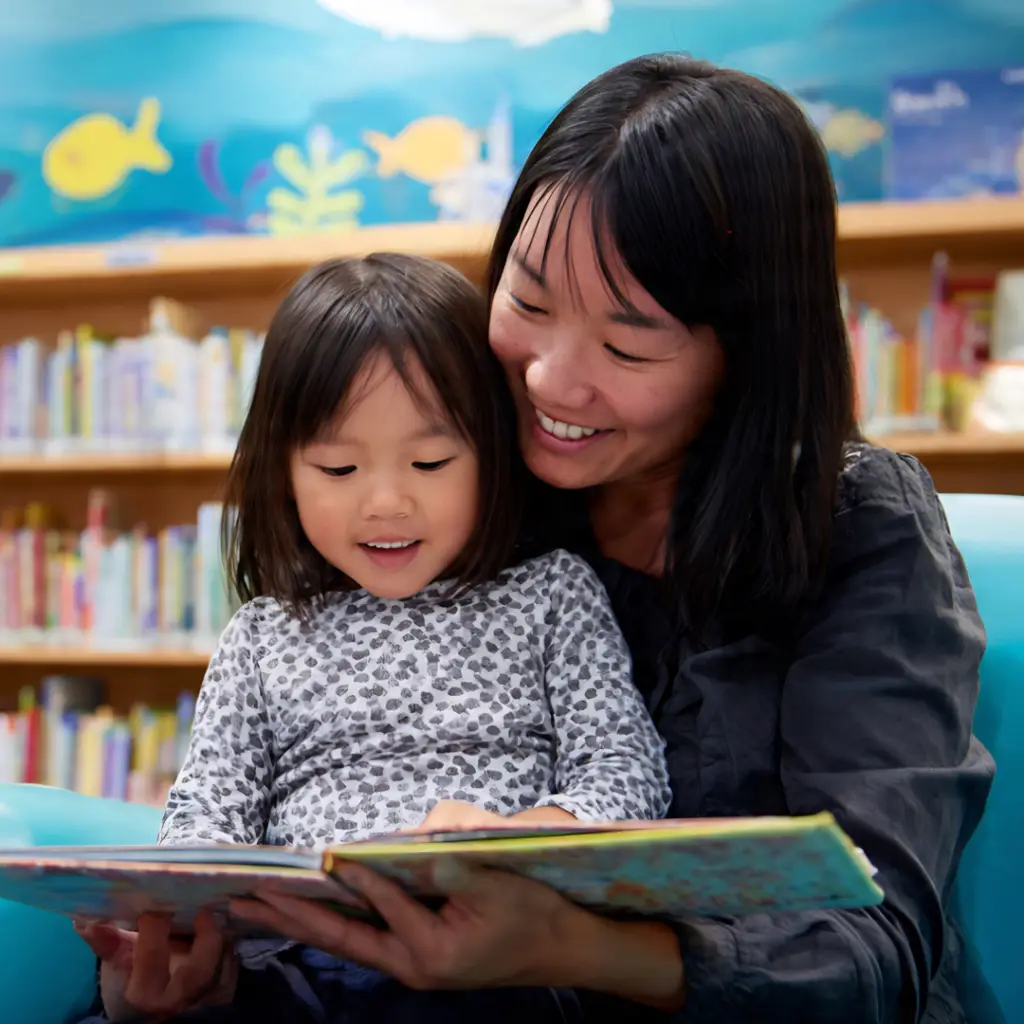 Mother and daughter reading a book