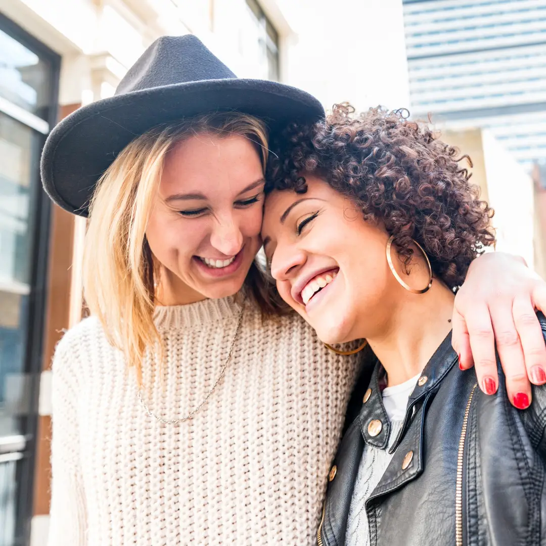 Smiling female couple