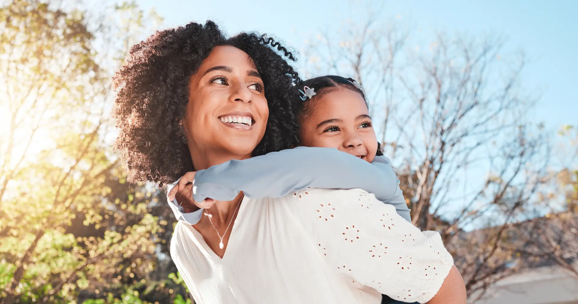 Mother, child and family outdoor with love and care for piggyback to a play game for fun in backyard. Smile of woman and girl kid in nature to relax together in summer with a hug for support or trust